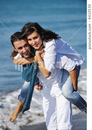 happy young couple have fun at beautiful beach happy young couple have fun at beautiful beach 6410530
