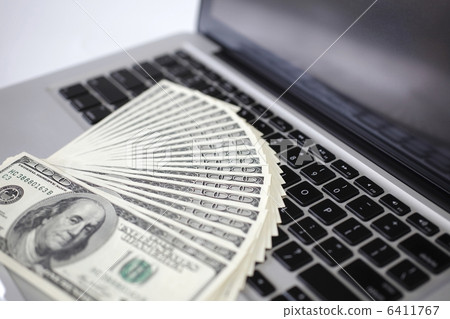 100 dollar banknote and personal computer 6411767