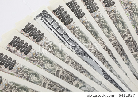 100 dollar bills and 10,000 yen notes 6411927