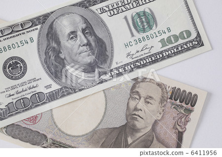 100 dollar bills and 10,000 yen notes 6411956