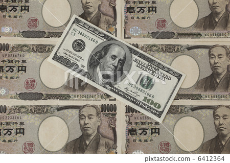 100 dollar bills and 10,000 yen notes 6412364