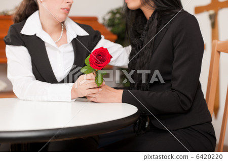 mortician with client comforting and advising 6420220