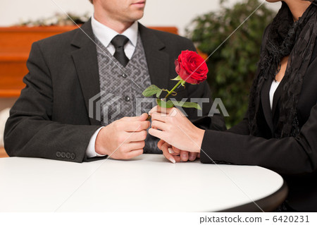 mortician with client comforting and advising 6420231
