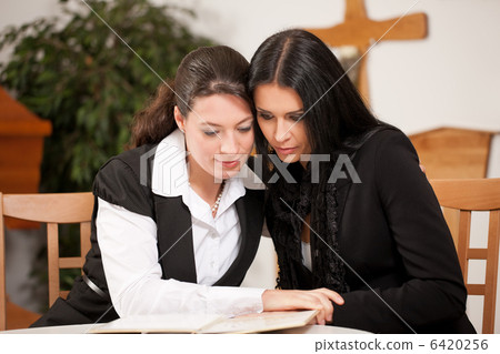 mortician with client comforting and advising 6420256