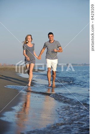 happy young couple have romantic time on beach 6429109