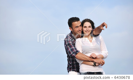 happy young couple have fun on beach 6430678