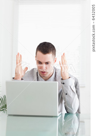 Businessman having problems with his notebook 6432005