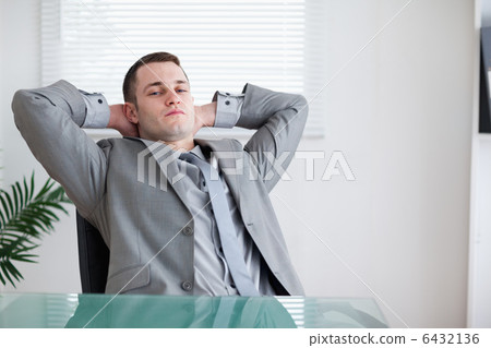 Young businessman taking a small break 6432136