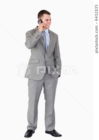 Businessman standing and phoning Businessman standing and phoning 6432835