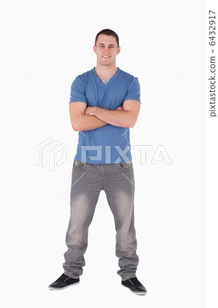 Portrait of a young man standing up 6432917