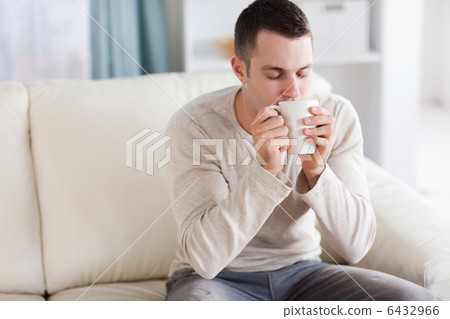 Good looking man having a tea 6432966