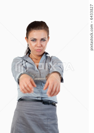 Portrait of a young businesswoman with handcuffs 6433827