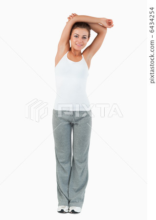 Portrait of a woman stretching her arms 6434254