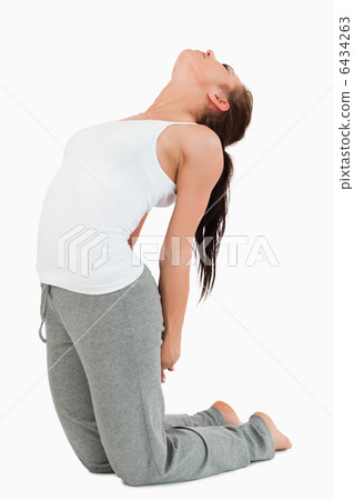 Fit woman in the Ustrasana position Fit woman in the Ustrasana position 6434263