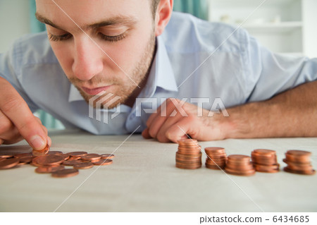Businessman counting coins 6434685