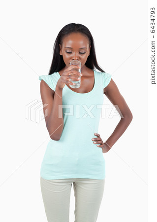 Young female drinking water 6434793