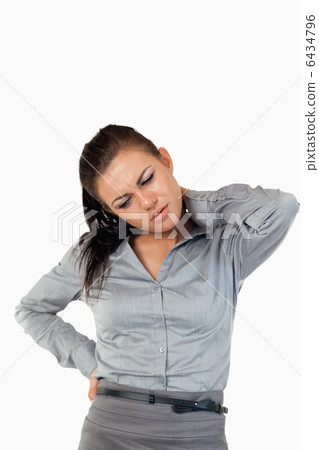 Portrait of a gorgeous businesswoman having back pain Portrait of a gorgeous businesswoman having back pain 6434796
