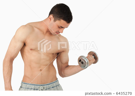 Young male lifting weight Young male lifting weight 6435270