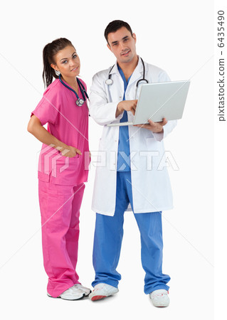 Portrait of doctors using a laptop Portrait of doctors using a laptop 6435490