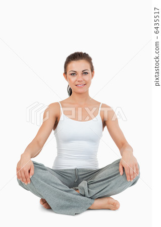 Portrait of a woman in the Sukhasana position 6435517