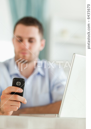 Cellphone being used for texting 6435670