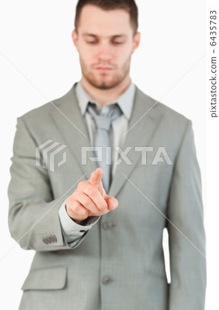 Businessman using futuristic touchscreen Businessman using futuristic touchscreen 6435783