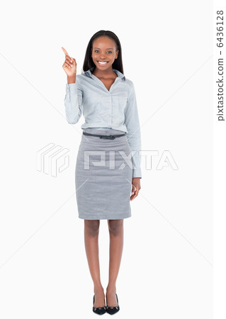 Portrait of a businesswoman pointing at something 6436128