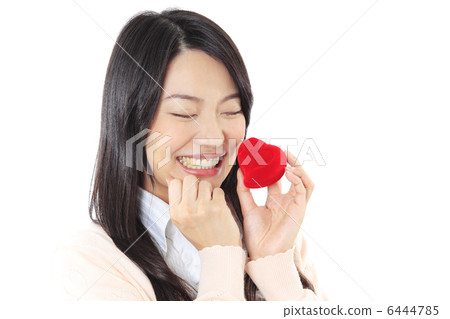 A gift box with a heart and a young lady A gift box with a heart and a young lady 6444785