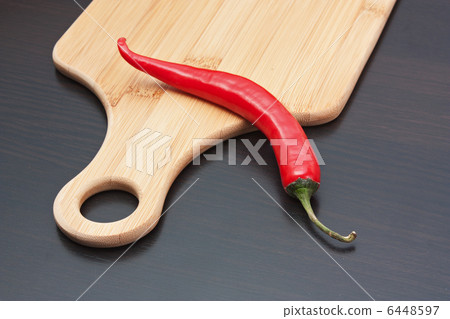 red pepper on cutting board red pepper on cutting board 6448597