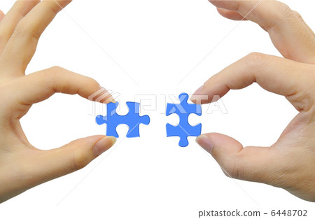 Jigsaw puzzle and hand 6448702