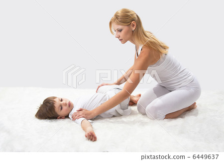 Mother and son do yoga before bed Mother and son do yoga before bed 6449637