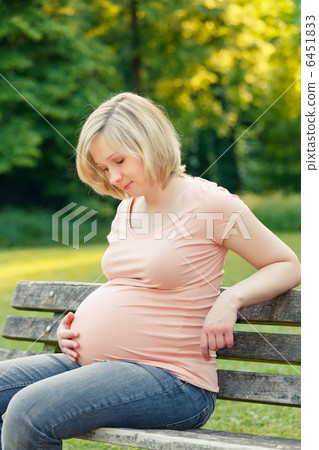 Pregnant woman in the park 6451833