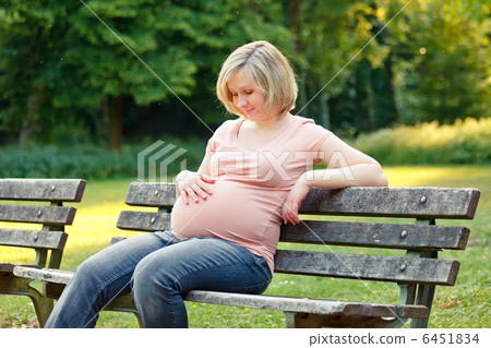 Pregnant woman in the park 6451834