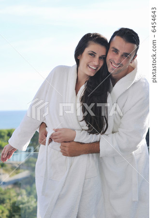 couple relaxing on balcony couple relaxing on balcony 6454643