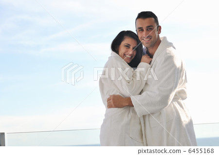 couple relaxing on balcony couple relaxing on balcony 6455168