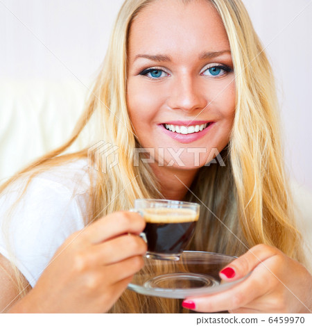 Closeup portrait of a pretty young female having a cup of coffee Closeup portrait of a pretty young female having a cup of coffee 6459970