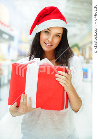 Portrait of young pretty woman wearing Santa Claus helper hat st Portrait of young pretty woman wearing Santa Claus helper hat st 6460136