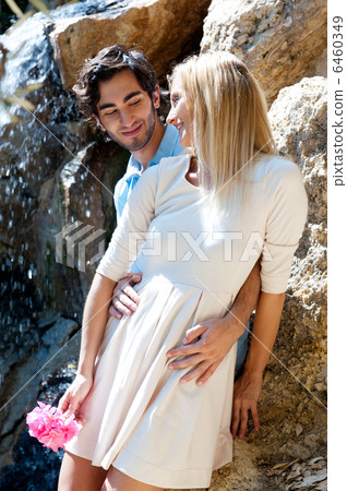 Portrait of love couple embracing outdoor in park looking happy. Portrait of love couple embracing outdoor in park looking happy. 6460349