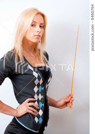 Portrait of young teacher pointing on white marker board in mode Portrait of young teacher pointing on white marker board in mode 6460764