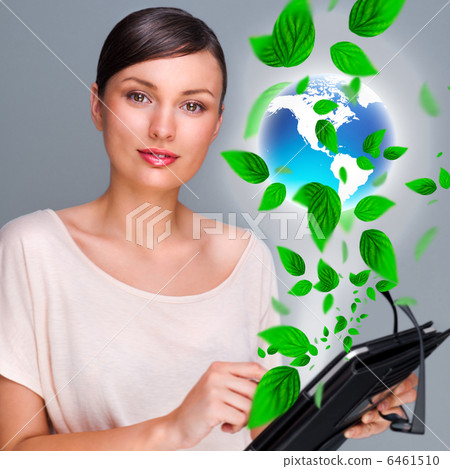 Portrait of young woman standing indoors at her office and worki Portrait of young woman standing indoors at her office and worki 6461510
