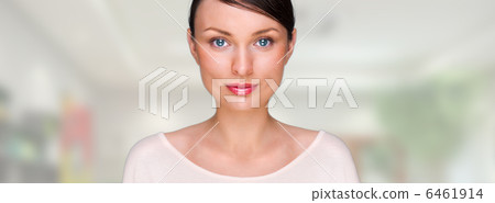 Closeup portrait of young pretty business woman standing at her 6461914