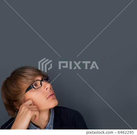 Image of young man thinking of his plans. Lots of copyspace Image of young man thinking of his plans. Lots of copyspace 6462295