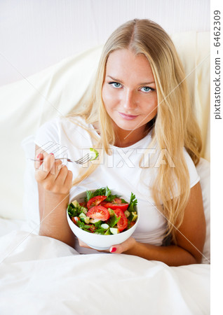 Closeup portrait of pretty caucasian woman having a healthy diet 6462309
