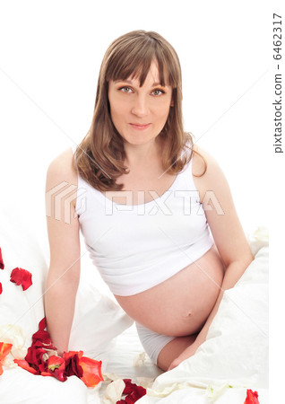 Image of pregnant woman touching her belly with hands 6462317