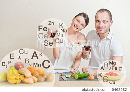 Young lovely couple cooking a balanced diet. Big copyspace. Vita 6462382