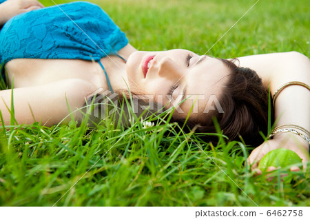 Pretty brunette girl wearing elegant dress relaxing outdoor in g Pretty brunette girl wearing elegant dress relaxing outdoor in g 6462758