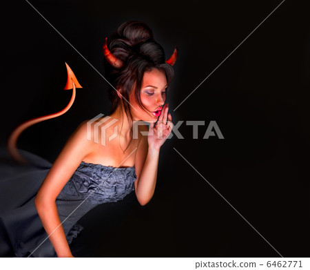 Sexy Devil woman with tail horns and red skin whispering somethi 6462771