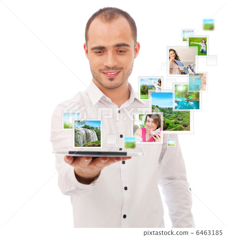 Portrait of young happy man sharing his photo and video files in Portrait of young happy man sharing his photo and video files in 6463185