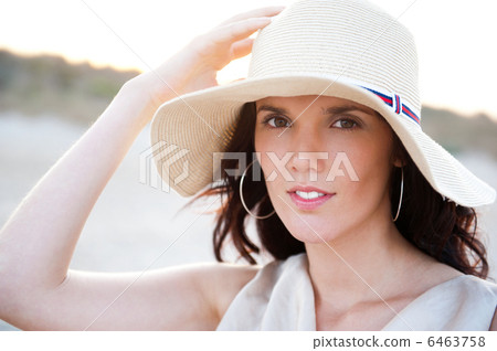 Summer portrait of beautiful woman wearing hat. Vacation at warm Summer portrait of beautiful woman wearing hat. Vacation at warm 6463758