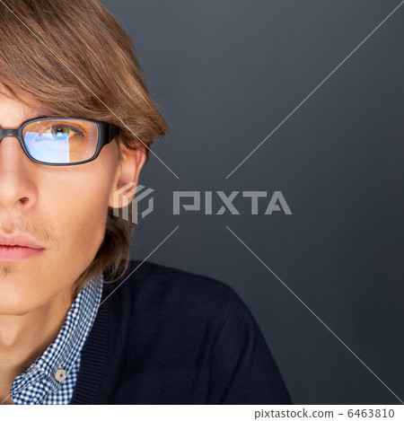 Portrait of young man with smart and wise look. Looking at camer Portrait of young man with smart and wise look. Looking at camer 6463810